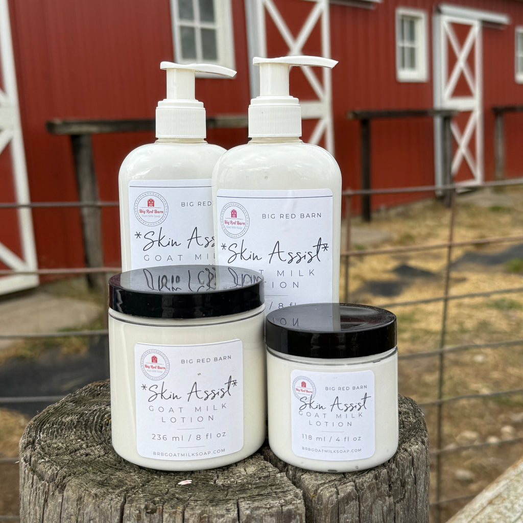 Three bottles of 'Skin Assist' product on a wooden surface with a red building in the background.