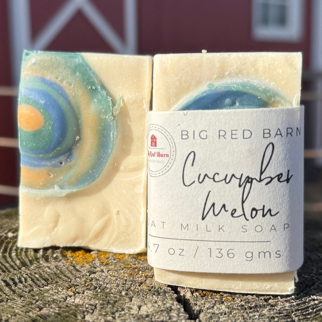 Bar of soap with packaging labeled 'Big Red Barn' in front of a red barn.
