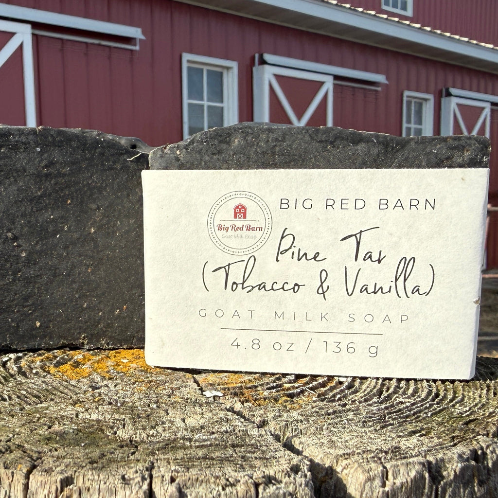 Bar of soap with a label in front of a red barn