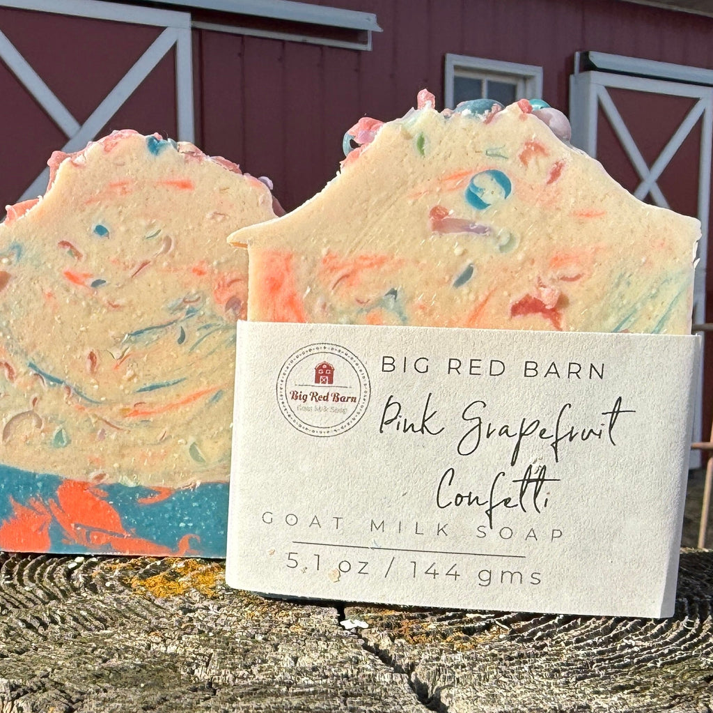 Two bars of confetti soap with a Big Red Barn label in front of a red barn.