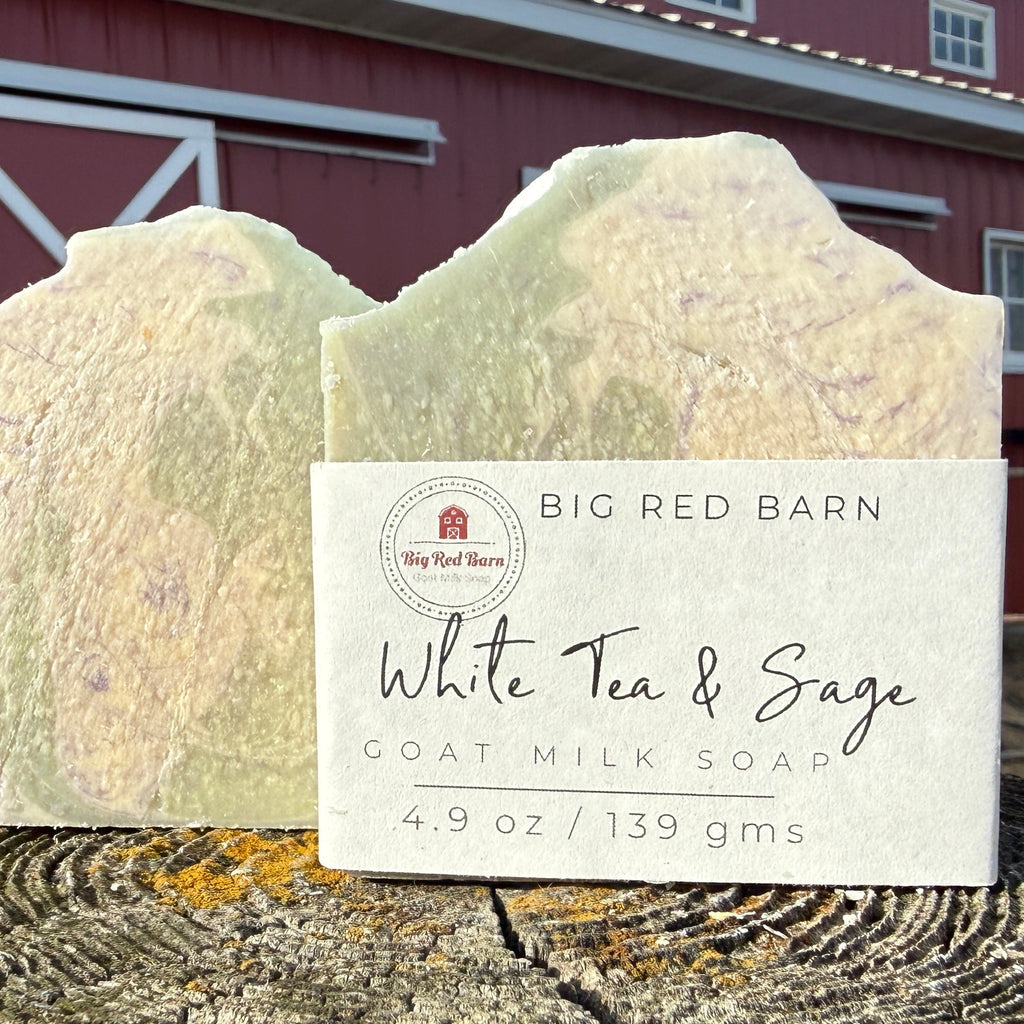 Goat milk soap bar with 'Big Red Barn' label in front of a red barn.